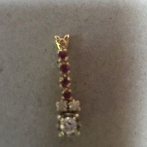 Beautiful charm. Ruby and diamonds